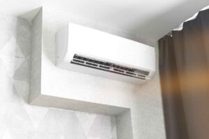 Ductless air conditioning system on white wall